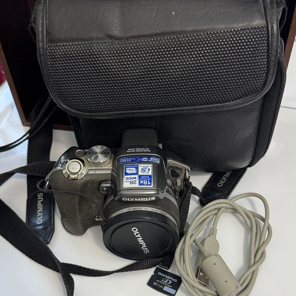 Olympus Digital Camera in Black with Neck Strap and USB Cable Bag